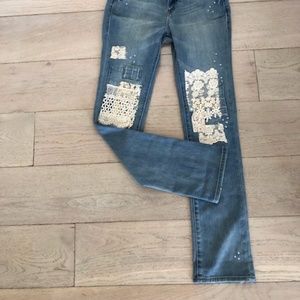 New from Sundance. Magnolia Lace patched jeans.